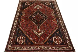 Surface texture of 2000s Shiraz rug with natural Wool and intricate pattern