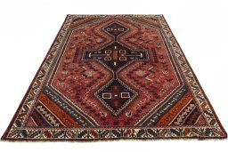Surface texture of 2000s Shiraz rug with natural Wool and intricate pattern