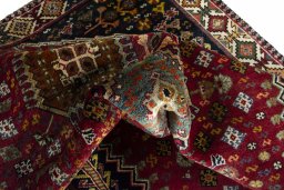 Corner detail of 2000s Shiraz rug showing border pattern and Wool pile