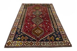 Surface texture of 2000s Shiraz rug with natural Wool and intricate pattern