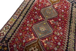 Backside of handmade 2000s Shiraz rug showing knot structure and weave density