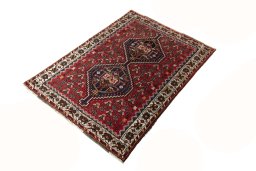 Corner detail of 2000s Shiraz rug showing border pattern and Wool pile