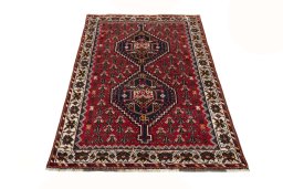 Surface texture of 2000s Shiraz rug with natural Wool and intricate pattern