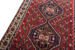Backside of handmade 2000s Shiraz rug showing knot structure and weave density