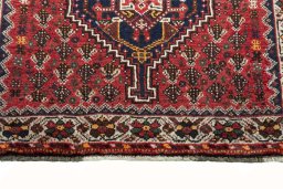 Central medallion detail of 2000s Shiraz rug from Iran / Persia