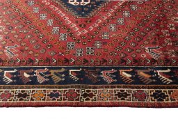 Corner detail of 2000s Shiraz rug showing border pattern and Wool pile