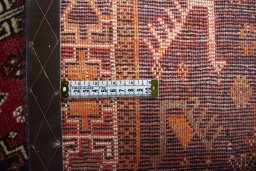 Backside of handmade 2000s Shiraz rug showing knot structure and weave density