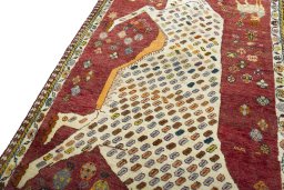 Backside of handmade 2000s Shiraz rug showing knot structure and weave density