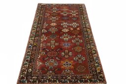 Surface texture of 2000s Shiraz rug with natural Wool and intricate pattern