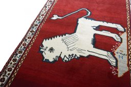 Backside of handmade 2000s Shiraz rug showing knot structure and weave density