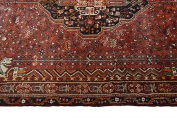 Corner detail of 2000s Shiraz rug showing border pattern and Wool pile