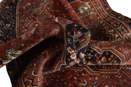 Surface texture of 2000s Shiraz rug with natural Wool and intricate pattern