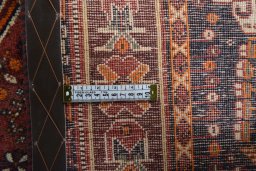 Backside of handmade 2000s Shiraz rug showing knot structure and weave density