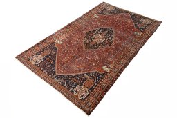 Corner detail of 2000s Shiraz rug showing border pattern and Wool pile