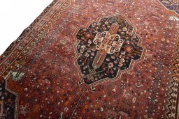 Backside of handmade 2000s Shiraz rug showing knot structure and weave density