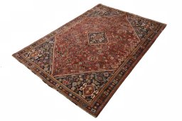 Corner detail of 2000s Shiraz rug showing border pattern and Wool pile
