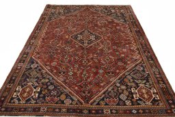 Surface texture of 2000s Shiraz rug with natural Wool and intricate pattern