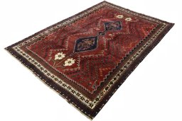 Corner detail of 2000s Shiraz rug showing border pattern and Wool pile