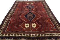 Surface texture of 2000s Shiraz rug with natural Wool and intricate pattern