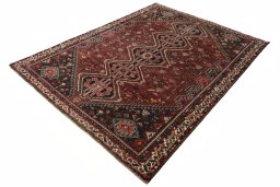 Corner detail of 2000s Shiraz rug showing border pattern and Wool pile