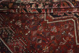 Full view of 2000s Shiraz rug from Iran / Persia, 315 × 242 cm in Red tones
