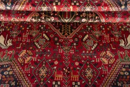 Corner detail of 2000s Shiraz rug showing border pattern and Wool pile