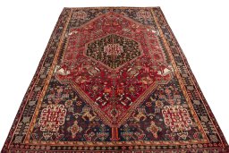 Surface texture of 2000s Shiraz rug with natural Wool and intricate pattern