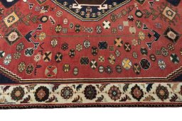 Corner detail of 2000s Shiraz rug showing border pattern and Wool pile