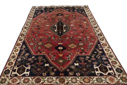 Surface texture of 2000s Shiraz rug with natural Wool and intricate pattern
