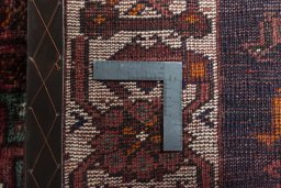 Backside of handmade 2000s Shiraz rug showing knot structure and weave density