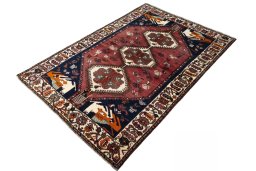 Corner detail of 2000s Shiraz rug showing border pattern and Wool pile