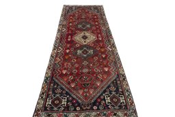 Surface texture of 2000s Shiraz rug with natural Wool and intricate pattern