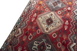 Backside of handmade 2000s Shiraz rug showing knot structure and weave density