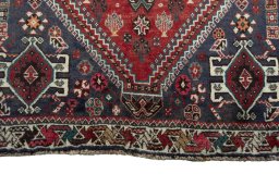 Central medallion detail of 2000s Shiraz rug from Iran / Persia