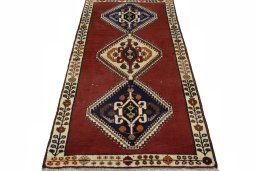 Surface texture of 2000s Shiraz rug with natural Wool and intricate pattern