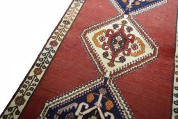 Backside of handmade 2000s Shiraz rug showing knot structure and weave density