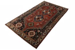 Corner detail of 2000s Shiraz rug showing border pattern and Wool pile