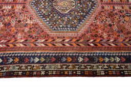 Corner detail of 2000s Shiraz rug showing border pattern and Wool pile
