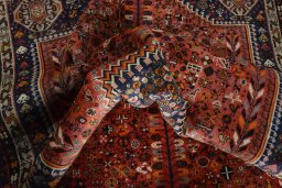 Surface texture of 2000s Shiraz rug with natural Wool and intricate pattern