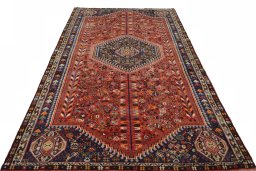 Surface texture of 2000s Shiraz rug with natural Wool and intricate pattern