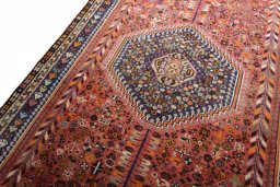 Backside of handmade 2000s Shiraz rug showing knot structure and weave density