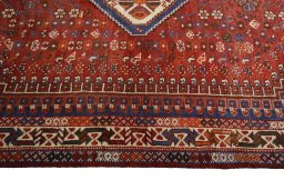 Corner detail of 2000s Shiraz rug showing border pattern and Wool pile