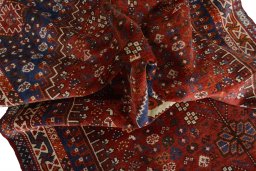 Surface texture of 2000s Shiraz rug with natural Wool and intricate pattern