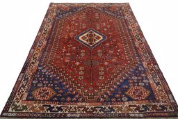 Surface texture of 2000s Shiraz rug with natural Wool and intricate pattern