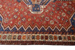 Corner detail of 2000s Shiraz rug showing border pattern and Wool pile