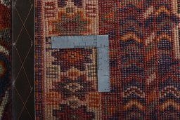 Backside of handmade 2000s Shiraz rug showing knot structure and weave density