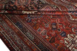 Corner detail of 2000s Shiraz rug showing border pattern and Wool pile