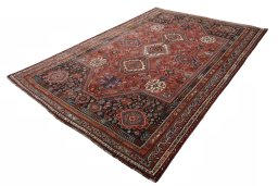 Corner detail of 2000s Shiraz rug showing border pattern and Wool pile