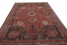 Surface texture of 2000s Shiraz rug with natural Wool and intricate pattern