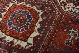 Full view of 2000s Shiraz rug from Iran / Persia, 318 × 214 cm in Red tones